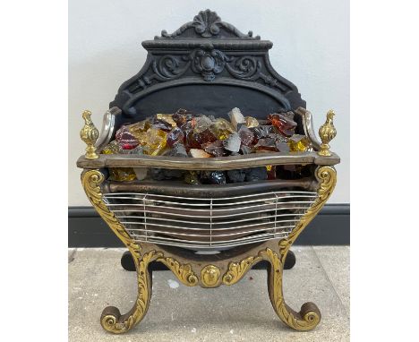 A 19th century style fire grate, with cast iron back, brass decoration to front, converted for use as an electric fireplace, 