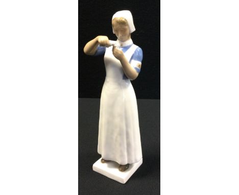 A Royal Copenhagen Bing and Grondhal Nurse, figure of nurse, model 2226,22.5cm high 
