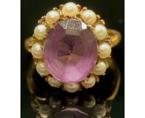 An amethyst and seed pearl dress ring, 9ct gold shank, 4.6g gross 