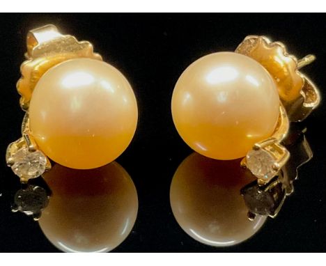 A pair of cultured pearl and white stone earrings, yellow metal mounts, stamped 417, 5.4g gross
