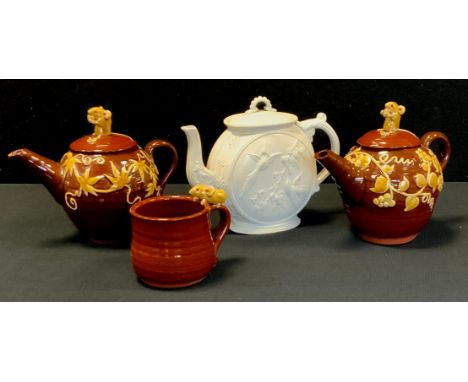 David Cleverley  - a red ware mouse topped tea pot, hot water pot and cup, impressed marks;  a 19th century aesthetic movemen