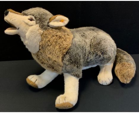 A Steiff Howling Wolf soft toy, yellow ear tag, 90cm long 