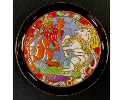 A Poole Pottery commemorative charger, a limited edition numbered 140, designed by Tony Morris, for the Queens Silver Jubilee