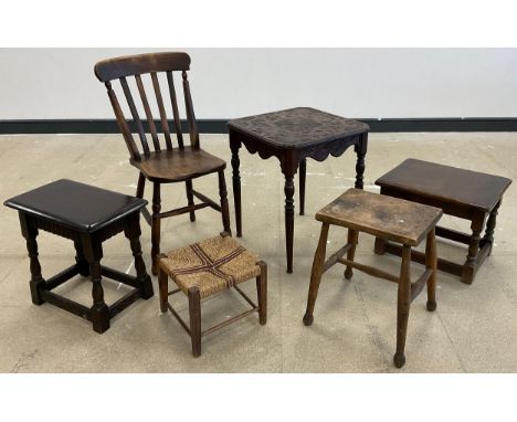 An Ercol style dark elm stool;  Victorian carved oak occasional table;  late 19th century elm chair;  19th century stool;  et