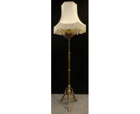 A Victorian brass telescopic oil/paraffin  standard lamp, later converted to electricity, tripod hoof feet, 155cm high 