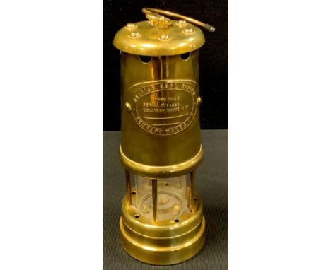 A brass British Coal Mining Company Wales Ltd miners lamp, vale, serial no 11922. 