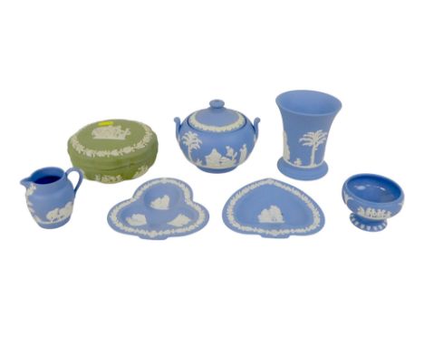 A group of Wedgwood jasperware, comprising vase, lidded sucrier, milk jug, heart shaped dish, trefoil shaped dish, small pede