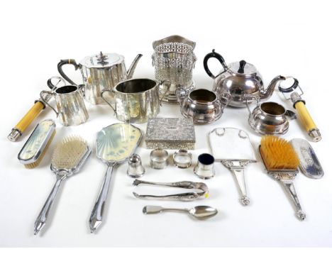 A group of silver plated wares, including two tea sets, two brush and mirror sets, a lidded box, candle sticks and a silver n