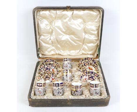 An Edwardian Royal Crown Derby Imari pattern coffee set, 2451, six settings, with Rococo style silver holders, coffee cans 4.