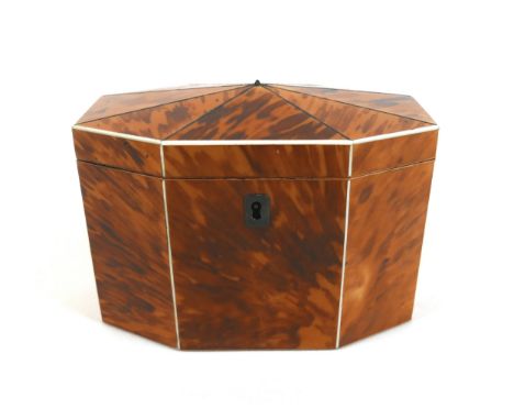 A Georgian tortoiseshell-veneered tea caddy, of octagonal section, with two division fitted interior, 17 by 10 by 12.5cm high