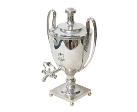 A silver plated Adam design tea urn, with two handles, each with acanthus leaf moulded mounts raised upon four ball feet, 29 