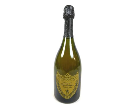 Vintage Champagne: a bottle of Moet &amp; Chandon Champagne, Cuvee Dom Perignon, Vintage 1999, together with a box and bookle