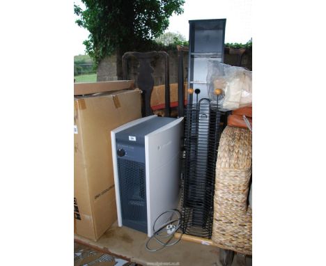 Two CD racks and an air purifier system.
