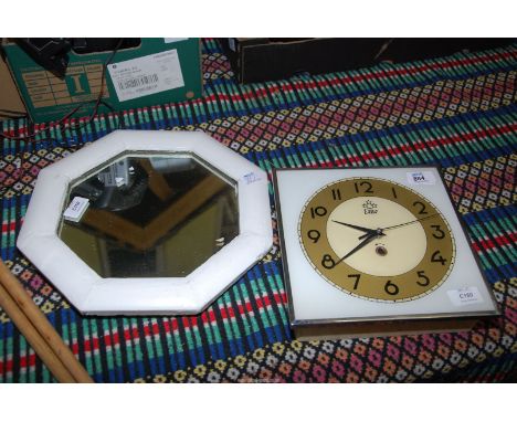 EME wall clock and a small octagonal mirror.