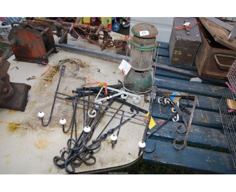 Wrought iron brackets, a door coat hanger and a Tilley lamp.