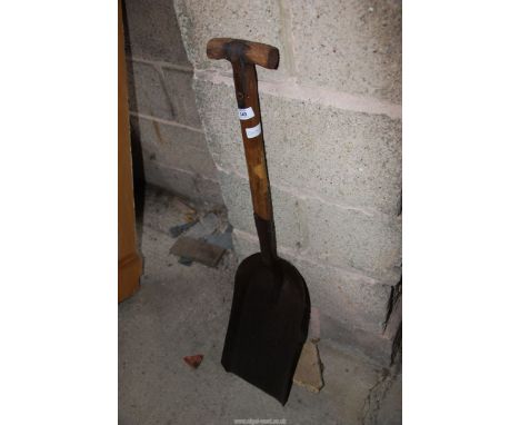 A vintage coal shovel.