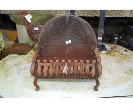 A cast iron fire grate - 18" high back, grate is 18" x 11" x 9" high.