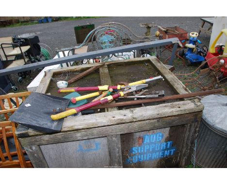 A snow shovel, two small G-clamps, plus a heavy duty cantilever lopper.