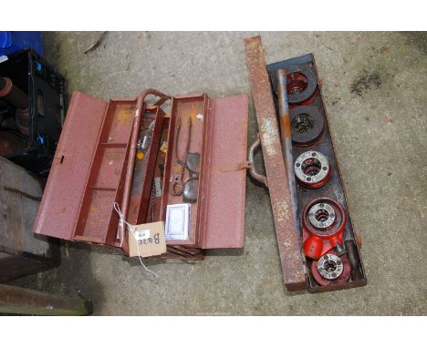 A cantilever tool box, auger bits, gauge etc, plus a large pipe thread cutting equipment ½" up to 2".