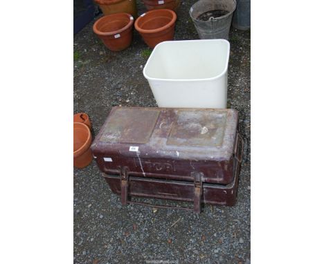 A plastic flip lid waste bin  and a metal tool chest.