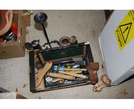 A pricket stand, cast iron bath feet and miscellaneous tools.