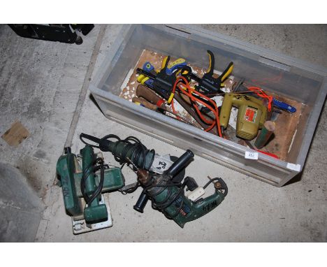 A 4½" proline angle grinder, Bosch 240 volt ½" chuck electric drill, Bosch 6" rip saw, hacker, etc.,