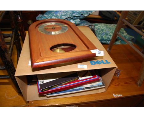 A welsh clock and a box of classical records.