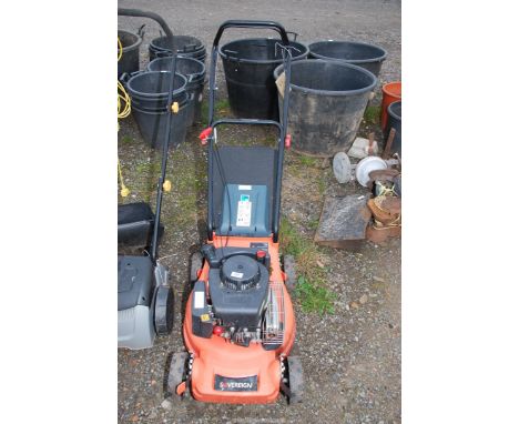 A 'Sovereign' 4 stroke petrol engine mower with grass box - good compression.