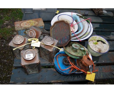 A quantity of enamel ware, bowls, dishes, chamber sticks and tea light lanterns, etc.,