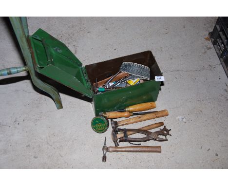 A metal Ammo box containing various tools, hammers, chisels, etc.,