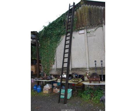 A 22 rung extending ladder with metal safety stay bars.