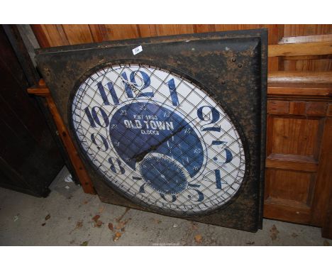 A large old town  clock 1 metre square.