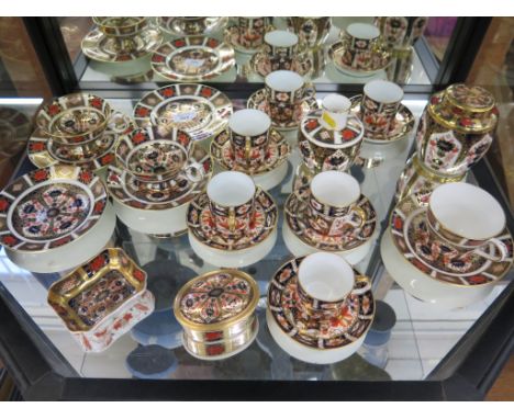 Royal Crown Derby Imari pattern tea and coffee cups with saucers, a ginger jar and cover, box and cover and a dish