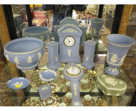 Wedgwood Jasperwares including a bowl, 22cm diameter, a clock garniture with two candlesticks and a barometer 