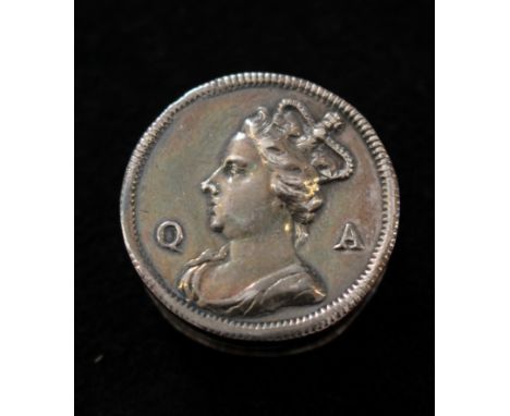 A small silver patch box with the head of Queen Anne to lid. Makers mark MC. c1705, 2.4cm diameter