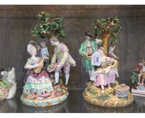 A matching pair of early 19th century Meissen figure groups, one depicting a lady playing guitar, a boy placing a garland on 