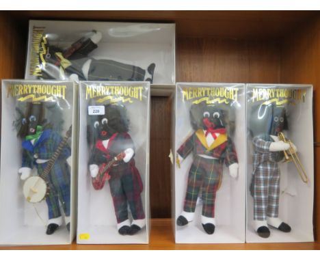 A set of five Merrythought Golly figures playing musical instruments, all with original boxes