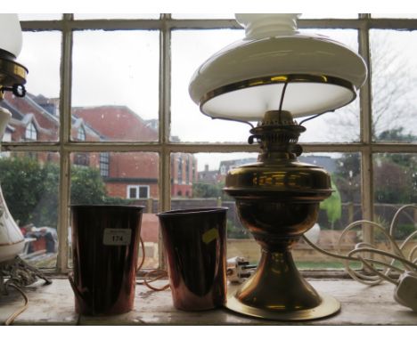 Two copper beakers and a brass oil lamp (3)