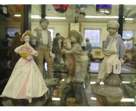 Three Lladro figures, including one of a boy holding a boat 22cm, another holding a donkey and a swordsman, and a Royal Worce