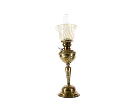 LATE VICTORIAN BRASS OIL LAMP, with clear glass chimney and vaseline glass shade, the reservoir, stem and foot embossed with 