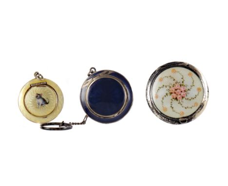 CHARMING SMALL CIRCULAR GUILLOCHE ENAMEL COMPACT, the hinged cover decorated with a seated kitten within a pale yellow ground