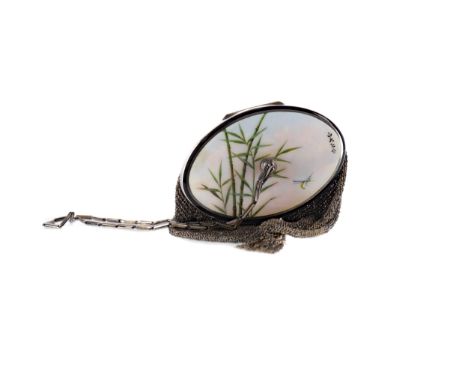 ATTRACTIVE SILVER AND MESH OVAL EVENING PURSE WITH COMPACT, the hinged cover with guilloche enamel panel decorated with a dra
