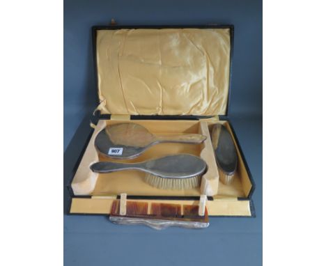 A silver four piece dressing table set in a presentation box
Condition report: Generally good, comb missing teeth 