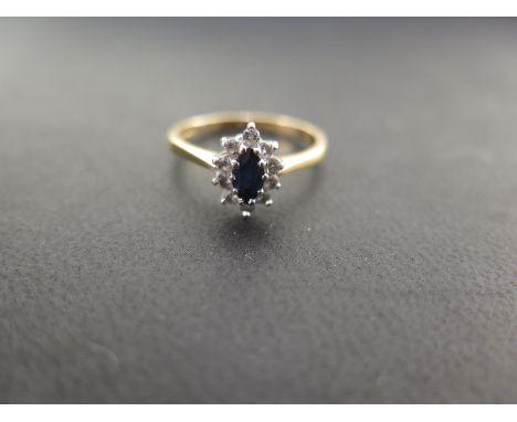 An 18ct gold sapphire and diamond cluster ring - Hallmarked London - Ring size N 1/2 - Weight approx 2.7gms
Condition Report: