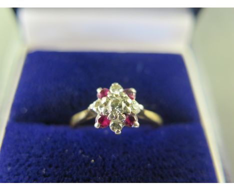 A ruby and diamond cluster ring - Tests as higher carat gold - Ring size J - Weight approx 1.9gms
Condition Report: Good - Wi