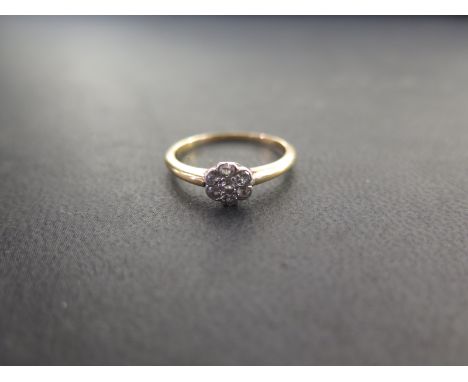 An old-cut diamond cluster ring - Stamped 18ct - Ring size M - Weight approx 2.3gms
Condition Report: Good - With light scrat