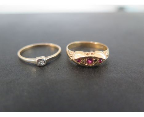 A diamond single-stone ring - Stamped 18ct and plat - Ring size P  - Together with an 18ct gold ruby and diamond boat-shape r