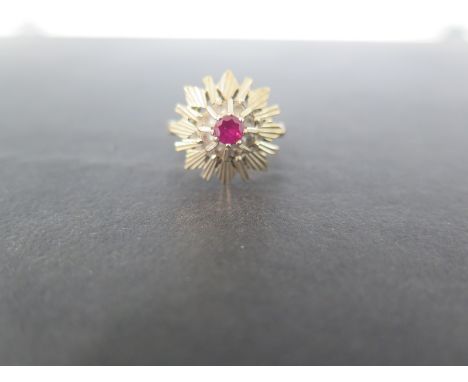 A 9ct gold ruby snowflake ring - Hallmarked London - Ring size L - Weight approx 3.9gms
Condition Report: Good