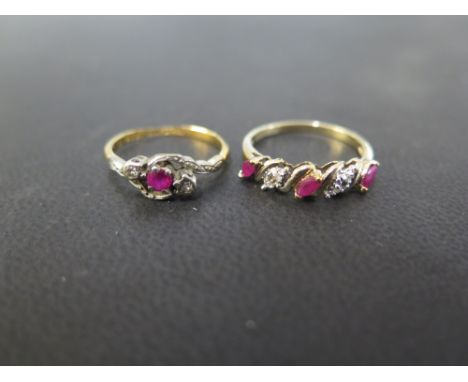 A ruby and diamond three-stone crossover ring - Stamped 18ct & plat - Ring size K 1/2 - Weight approx 2.2gms - Together with 