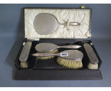 A silver five piece dressing table set in presentation box 
Condition report: Some small denting, missing comb and wear 